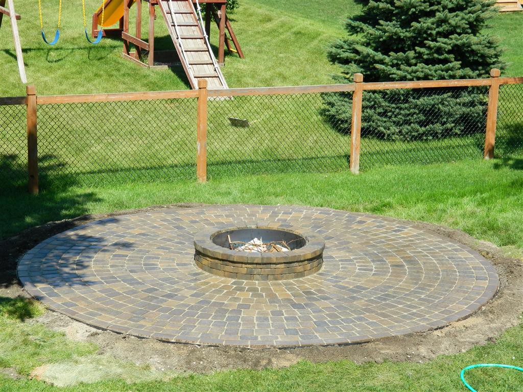 15' diameter circle paver patio surrounding firepit